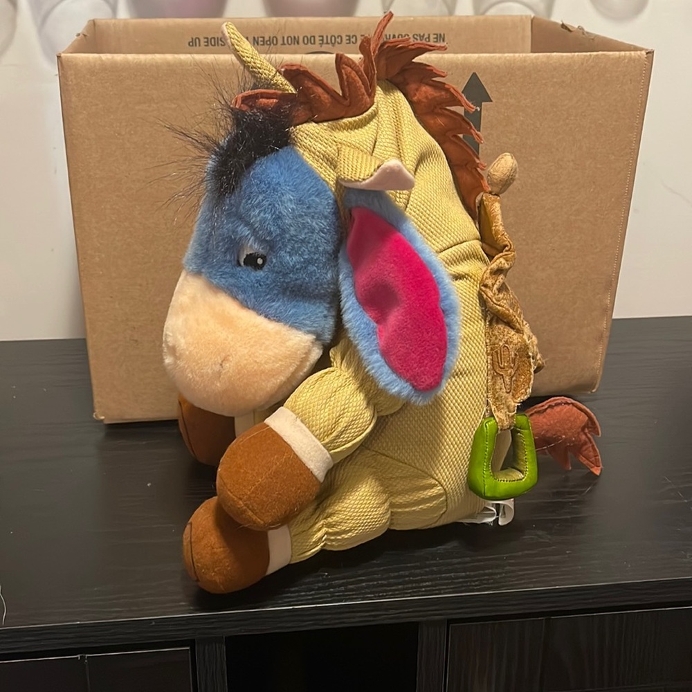 Disneys eeyore dressed as toy story’s bullseye